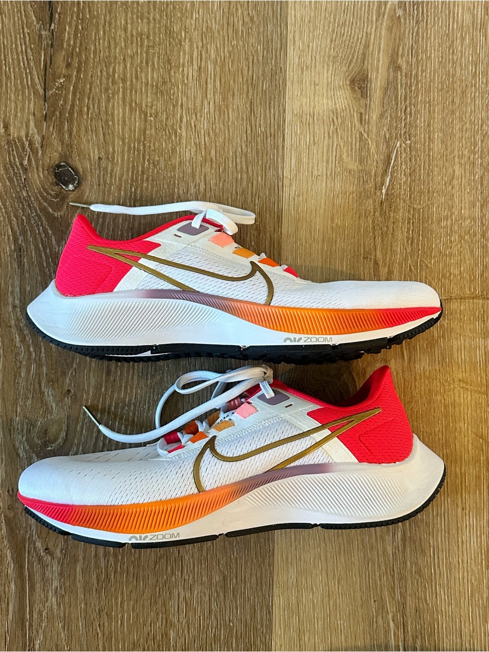 Nike White Running Shoes with Pink Heel and Orange Gradient